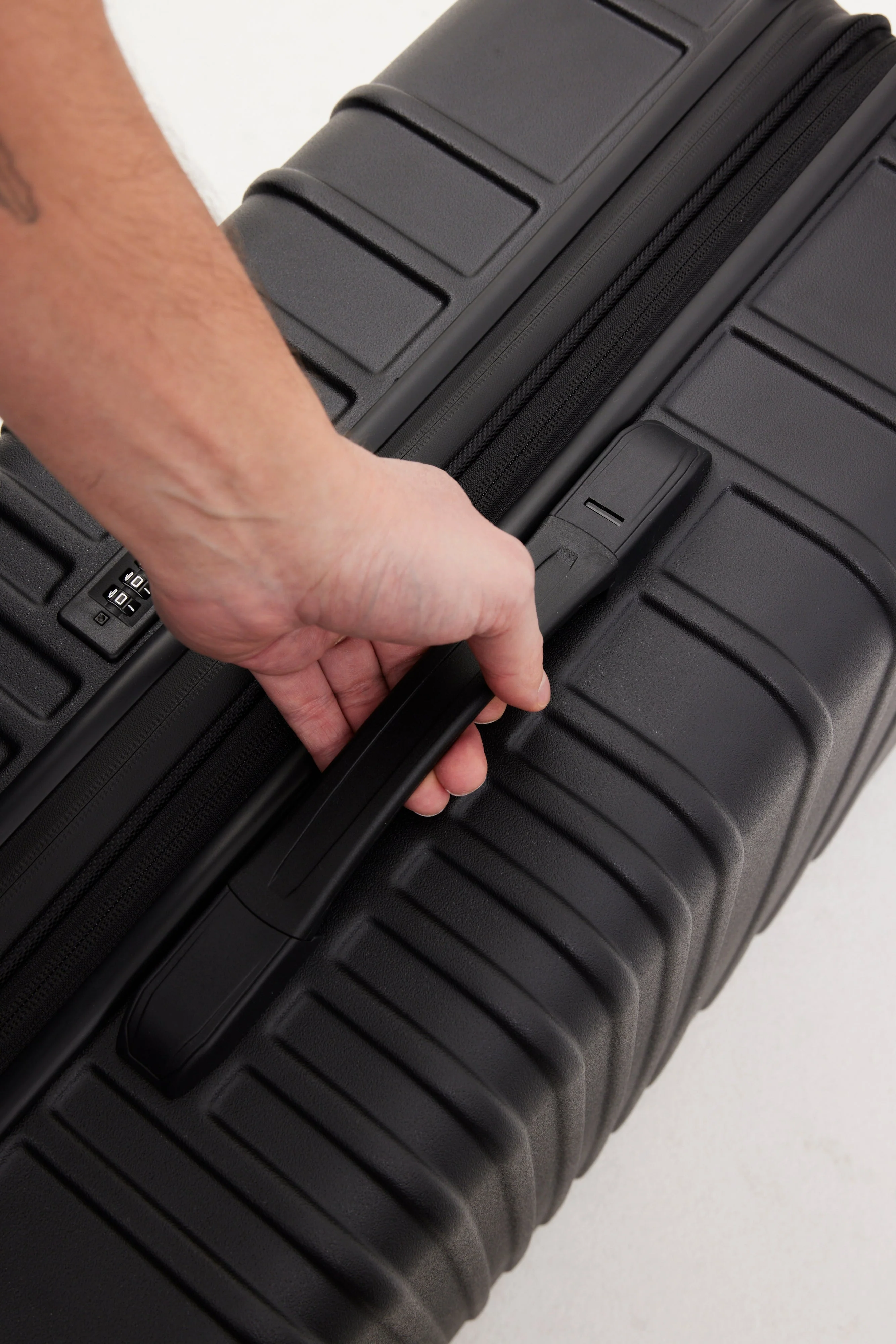 The Large Check-In Roller in All Black - Image 11